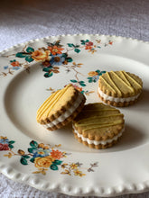 Load image into Gallery viewer, Lemon Poppyseed Sandwich Cookies
